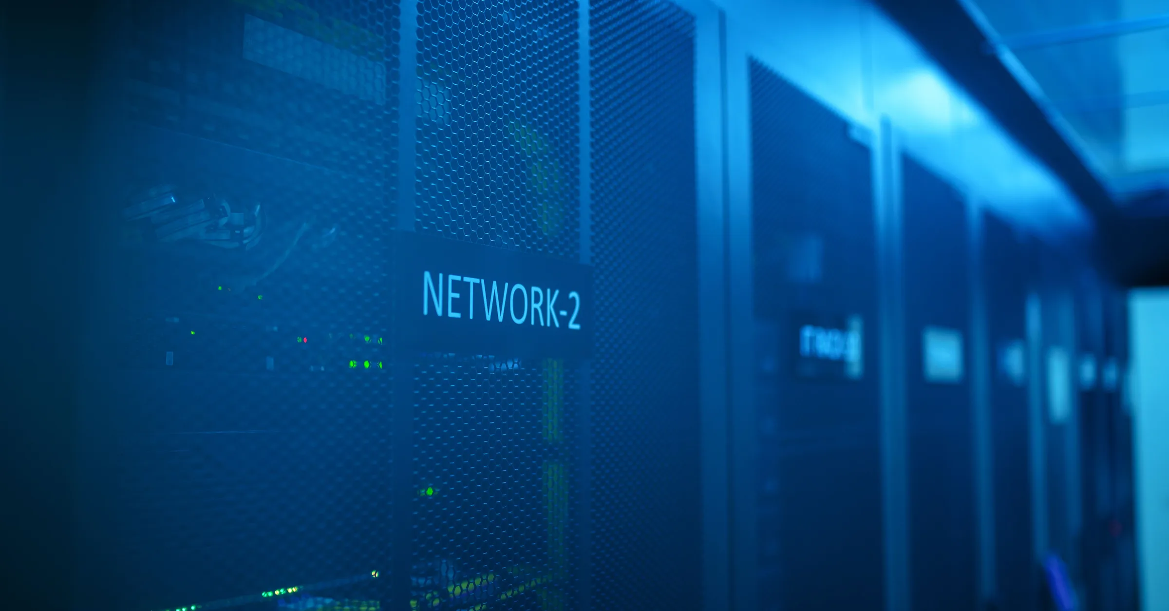 Network equipment in a data centre, lit blue