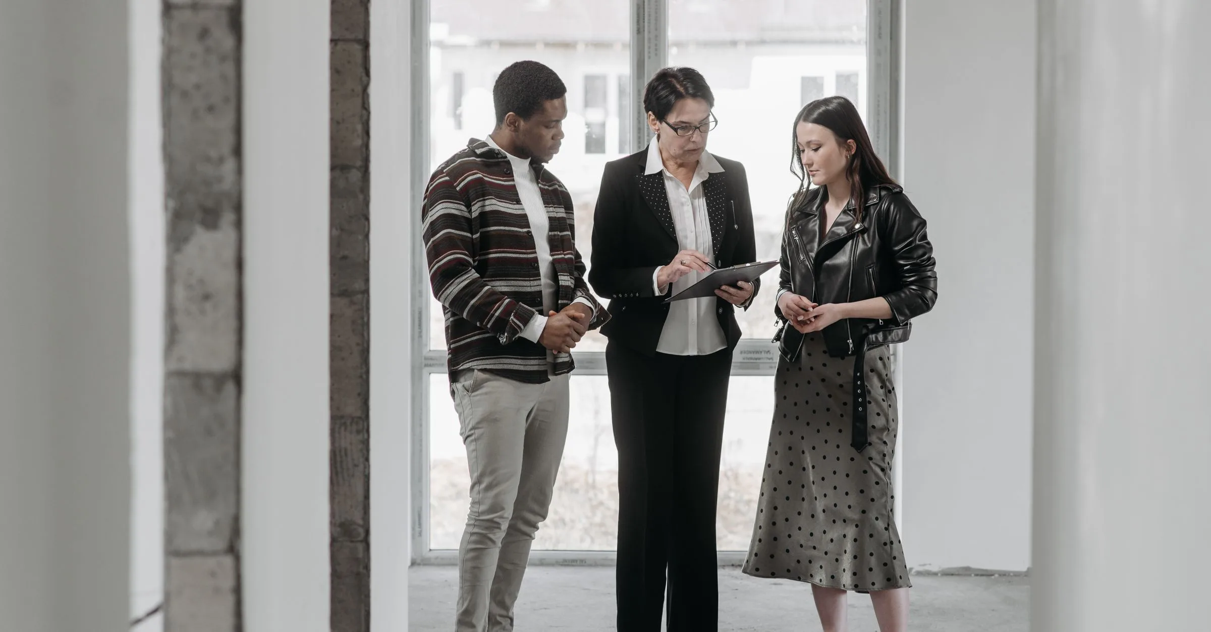 Dubai real estate agent showing a property to buyers who enquired through a Meta lead ad